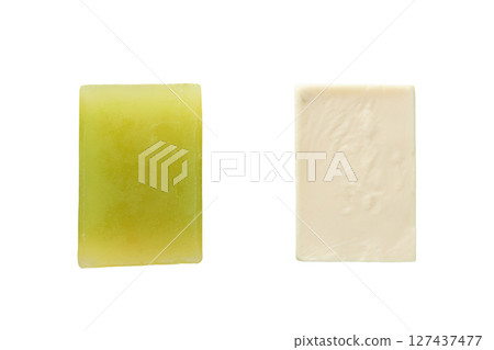 Two textured green and white soap bars, isolated on white 127437477