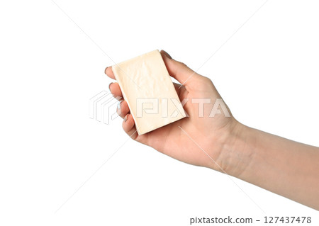 Hand presenting a bar of soap on white background, isolated on white Hand presenting a bar of soap on white background, isolated on white 127437478