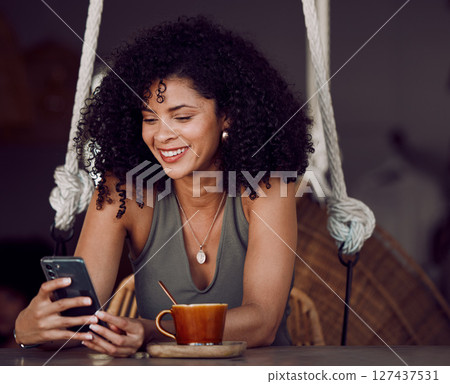 Black woman, phone and coffee in cafe, restaurant or coffee shop on social media, internet news or fun esports game. Happy smile, relax afro student and entrepreneur with tea cup or mobile technology 127437531