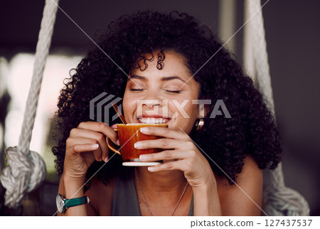 Happy black woman, drinking coffee and relax in cafe, restaurant and peace, freedom and easy lifestyle. Female happy customer enjoying cup of tea, cappuccino and warm beverage in coffee shop alone 127437537