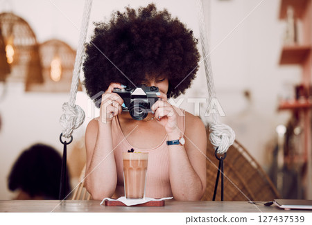 Camera, photography and woman in coffee shop for content marketing, drink advertising and menu update on website or social media. Black woman influencer, photographer or content creator in restaurant Camera, photography and woman in coffee shop for content marketing, drink advertising and menu update on website or social media. Black woman influencer, photographer or content creator in restaurant 127437539