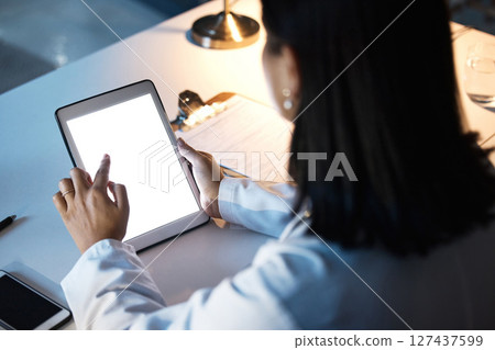 Night business, woman and tablet, screen and website research, iot innovation and data planning at office desk. Female worker using digital app in dark company, technology software and brand strategy Night business, woman and tablet, screen and website research, iot innovation and data planning at office desk. Female worker using digital app in dark company, technology software and brand strategy 127437599