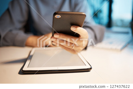 Smartphone, tablet and hands at office desk for digital marketing, multimedia application and software company update. Creative, corporate and productivity business woman using phone for social media Smartphone, tablet and hands at office desk for digital marketing, multimedia application and software company update. Creative, corporate and productivity business woman using phone for social media 127437622