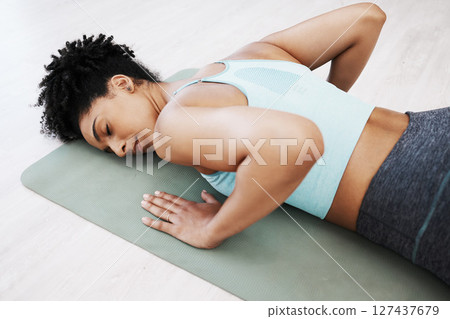 Yoga, meditation and zen woman in pilates for mind and body relaxation with peace, wellness and balance at home. Mindfulness, fitness and spiritual girl training in a calm mindset in the home studio 127437679