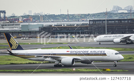 Singapore Airlines heading to the parking lot at Haneda Airport Singapore Airlines heading to the parking lot at Haneda Airport 127437718