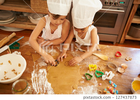 Family, baking and children learning to shape cookies at a table, development and bond in a kitchen. Cake, cutter and boy kids having fun while making biscuits, playing and being creative with flour Family, baking and children learning to shape cookies at a table, development and bond in a kitchen. Cake, cutter and boy kids having fun while making biscuits, playing and being creative with flour 127437873