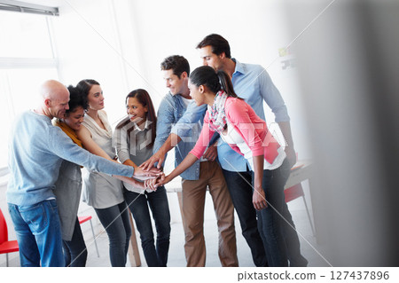 Happy, motivation and holding hands for teamwork at startup for cooperation, solidarity and goal. Partnership, strategy or support of marketing people excited for new venture together at company. 127437896