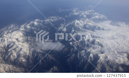 Hida Mountains or northern alps, a Japanese mountain range which stretches through Nagano, Toyama and Gifu prefectures in aerial view 127437915