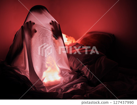 Ghost, sheet and red light in bedroom for scary story, horror and evil at night with human silhouette. Person in home bedroom for thriller, creepy and Halloween background with insomnia fear for dark Ghost, sheet and red light in bedroom for scary story, horror and evil at night with human silhouette. Person in home bedroom for thriller, creepy and Halloween background with insomnia fear for dark 127437990