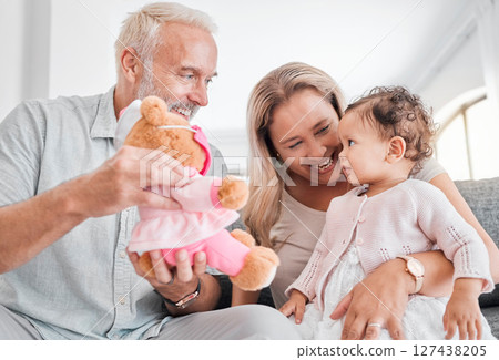 Toy, grandparents and baby play, happy and smile together in family home. Family, teddy bear and senior people with girl kid, development and child bonding with happiness, love and care in house Toy, grandparents and baby play, happy and smile together in family home. Family, teddy bear and senior people with girl kid, development and child bonding with happiness, love and care in house 127438205
