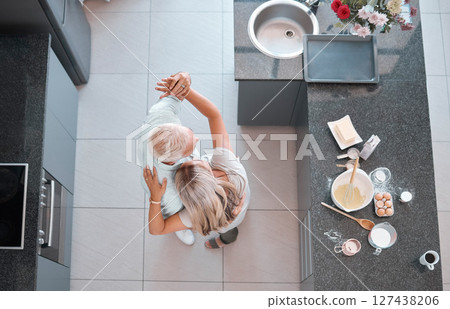 Top view couple, dancing and home kitchen for cooking, happy romance or love bonding together. Senior man, woman dancer or dance movement on floor for steps, touch and retirement house with food 127438206