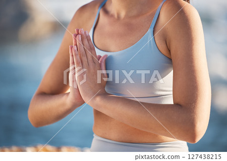 Hands, yoga and meditation with a woman athlete outdoor in nature for mental health or wellness. Fitness, workout and zen with a female yogi sitting in the prayer position for inner peace or balance Hands, yoga and meditation with a woman athlete outdoor in nature for mental health or wellness. Fitness, workout and zen with a female yogi sitting in the prayer position for inner peace or balance 127438215
