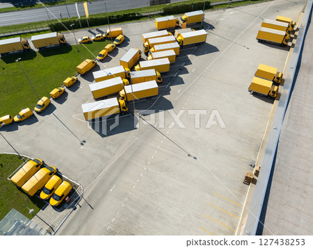 Delivery vans and trucks hub. Fleet of yellow post vehicles. Delivery vans and trucks hub. Fleet of yellow post vehicles. 127438253