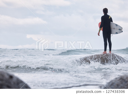 Sports, ocean surfing and man ready for fitness challenge, nature practice training or waves travel in sea water mock up. Sky storm clouds, adventure and mockup back view of surfer with freedom peace 127438306