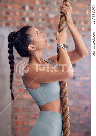 Woman, rope climb and fitness, muscle and strong with upper body workout at gym, active lifestyle and training for health and wellness. Exercise, core strength and endurance with sport motivation. 127438307