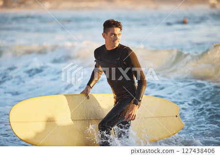 Surfing, water sports and surfer man at beach for fitness, wave and adventure during summer travel in Australia. Happy man in sea with surfboard for freedom, training and professional sport 127438406