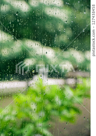 Water droplets on the window on a rainy day 127438458