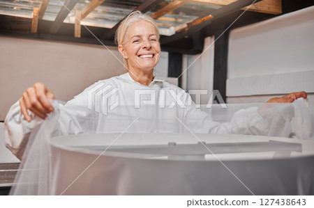 Beekeeper, honey farming and agriculture with a woman farmer working in a warehouse or factory. Farm, sustainability and industry with a female at work in agricultural production or manufacturing Beekeeper, honey farming and agriculture with a woman farmer working in a warehouse or factory. Farm, sustainability and industry with a female at work in agricultural production or manufacturing 127438643