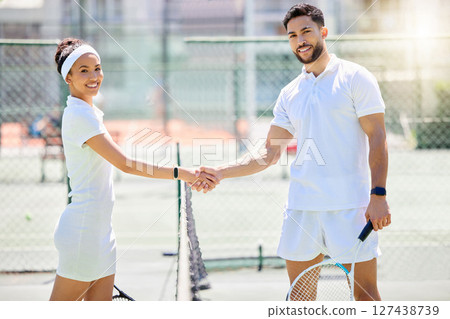 Game, tennis and portrait of athletes shaking hands for success, partnership and greeting. Handshake, fitness and sports man and woman training, practicing or playing match on an outdoor tennis court 127438739