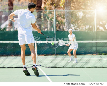 Tennis game, team sports and training for healthcare motivation or exercise workout outdoor. Professional athlete, teamwork collaboration and cardio competition together for fitness on tennis court Tennis game, team sports and training for healthcare motivation or exercise workout outdoor. Professional athlete, teamwork collaboration and cardio competition together for fitness on tennis court 127438765