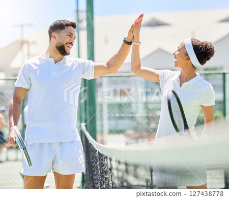 Tennis, sport and high five with coach and athlete, support and celebrate success in training workout. Man, woman and mentor for sports, fitness on tennis court outdoor with goal achievement and yes. Tennis, sport and high five with coach and athlete, support and celebrate success in training workout. Man, woman and mentor for sports, fitness on tennis court outdoor with goal achievement and yes. 127438778