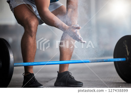 Strong man, powder hands and barbell exercise, challenge and workout in gym, fitness club and body muscle. Closeup of bodybuilder, chalk and weightlifting, grip and training, performance and power 127438899