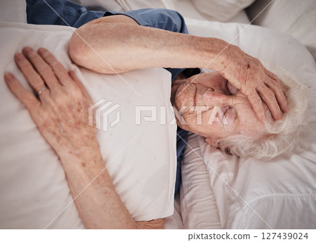 Headache, pain and senior woman in bed for trauma recovery, rehabilitation or rest in elderly care nursing home. Healthcare problem, medical emergency crisis and retirement patient with brain cancer Headache, pain and senior woman in bed for trauma recovery, rehabilitation or rest in elderly care nursing home. Healthcare problem, medical emergency crisis and retirement patient with brain cancer 127439024