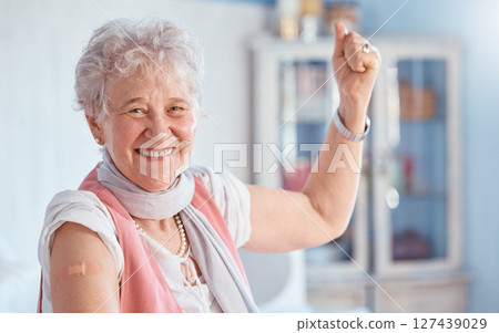 Covid, vaccine and bandaid with portrait of old woman for healthcare, medical and wellness. First aid, insurance and safety with senior patient and plaster for virus, protection and medicine 127439029