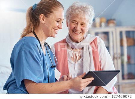 Nursing home, senior patient and nurse with tablet, medical exam results or digital report of stethoscope heart test. Medical support, communication and happy old woman consulting healthcare worker 127439072