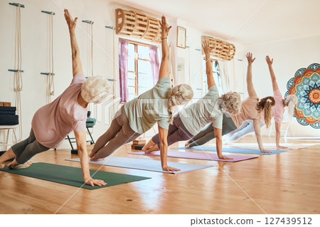 Yoga, class and group for elderly woman in health, fitness or zen meditation on gym floor. Workout, women and stretching for wellness, peace or calm balance exercise in mindfulness training together 127439512
