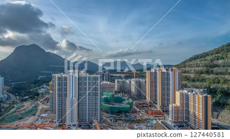 June 8 2025 Modern Urban Development with Mountains and Blue Sky June 8 2025 Modern Urban Development with Mountains and Blue Sky 127440581