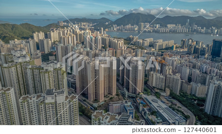 June 8 2025 Urban Skyline with Mountains and Waterfront in Vibrant Cityscape 127440601