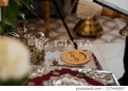 Orthodox Christian Communion Ritual Still Life: Silver Chalices, Paten, Red Cloth, Golden Objects, Candles, Religious Ceremony, Church Interior, Dark Tones 127440867