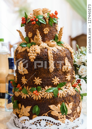 Ornate Wedding Honeycomb Cake Decorated with Wheat, Grapes, Berries, and Flowers, Brown Rustic Style Ornate Wedding Honeycomb Cake Decorated with Wheat, Grapes, Berries, and Flowers, Brown Rustic Style 127440873