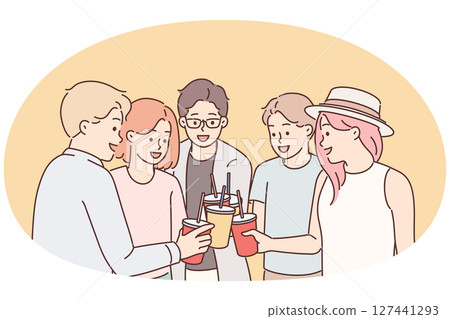 Group of young guys and girls drink drinks during holiday party from disposable cups with straw 127441293