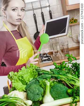 Woman having green vegetables thinking about cooking 127441480