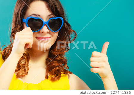 Girl in blue sunglasses portrait 127441526