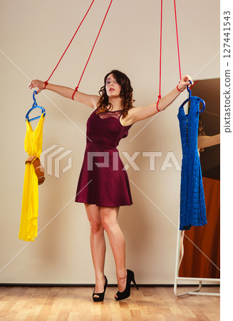 Addicted to shopping woman girl marionette with clothes 127441543
