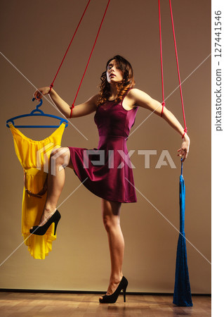 Addicted to shopping woman girl marionette with clothes Addicted to shopping woman girl marionette with clothes 127441546