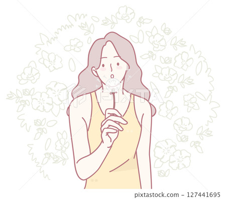 A Thoughtful Woman Gracefully Surrounded by Beautiful Floral Elements and Natural Imagery 127441695