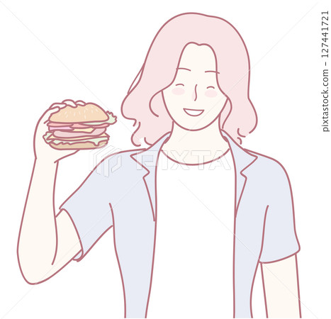 Indulging in a Mouthwatering and Delicious Burger while Brightly Displaying a Joyful Smile Indulging in a Mouthwatering and Delicious Burger while Brightly Displaying a Joyful Smile 127441721