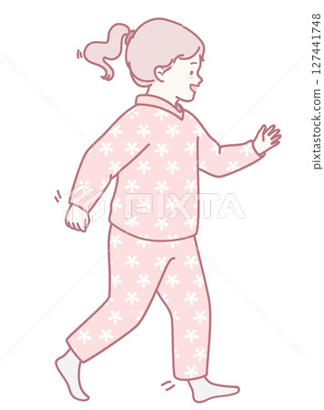 A joyful child in colorful pajamas happily walks around the home, filled with innocence 127441748
