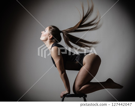 Atletic woman fit slim body posing 127442047