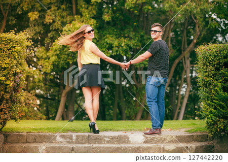 Walking couple back view Walking couple back view 127442220