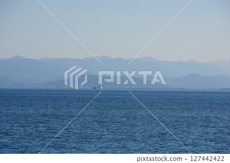 Awajishima, Hyogo Prefecture: View of Tokushima City and Mt. Bizan from Higashimachi Beach 127442422