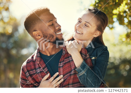 Nature, walking and diversity couple with outdoor adventure, travel and journey for wellness, love and support in summer bokeh. Happy black man with woman on piggyback ride for holiday, vacation date 127442571