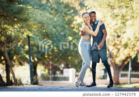 Workout, couple and hug in park portrait for exercise, fitness and walk break with smile for affection. Interracial, love and wellness of happy people dating on cardio rest together in New York. Workout, couple and hug in park portrait for exercise, fitness and walk break with smile for affection. Interracial, love and wellness of happy people dating on cardio rest together in New York. 127442579