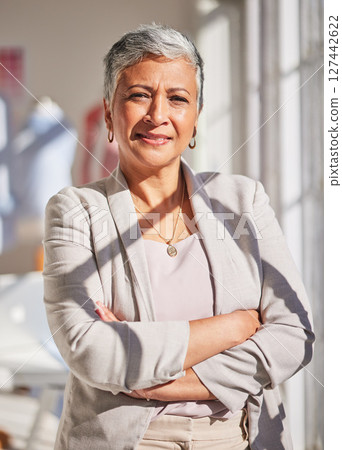 Fashion design, business and portrait of senior woman with crossed arms standing in design studio. Leadership, success and mature black woman with startup in fashion, cosmetics and clothing industry Fashion design, business and portrait of senior woman with crossed arms standing in design studio. Leadership, success and mature black woman with startup in fashion, cosmetics and clothing industry 127442622