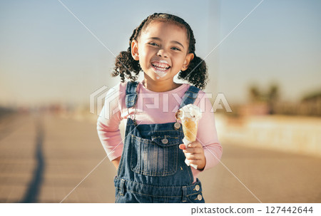 Summer, ice cream and happy portrait of child with smile and dripping face walking on street. Happiness, dessert and small girl laughing with ice cream cone and messy mouth, fun and enjoying holiday. Summer, ice cream and happy portrait of child with smile and dripping face walking on street. Happiness, dessert and small girl laughing with ice cream cone and messy mouth, fun and enjoying holiday. 127442644