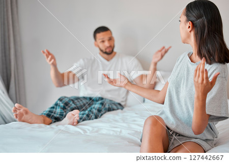 Confused, conflict and fight of couple in bedroom with doubt, liar and trust problem in marriage. Frustrated, questioning and angry people on bed in discussion on cheating, divorce and decision. 127442667